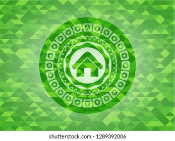 home icon inside realistic green emblem. Mosaic background