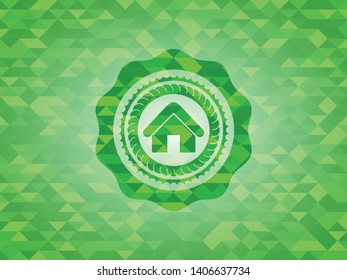 home icon inside realistic green emblem. Mosaic background