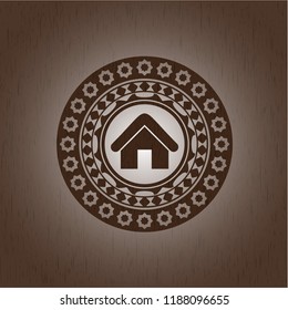 home icon inside vintage wood emblem