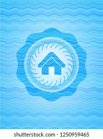 home icon inside water representation emblem.