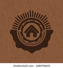 home icon inside wooden emblem