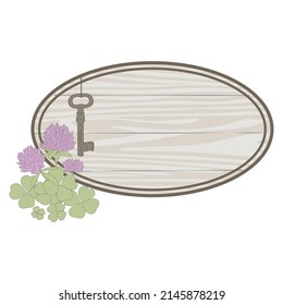 home key and wooden board with shamrock flower