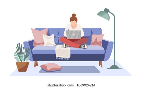 Home office concept. Self-isolation during the coronavirus epidemic. Woman working from home sitting on a sofa, remote work concept. Freelancer. The interior of the room. 