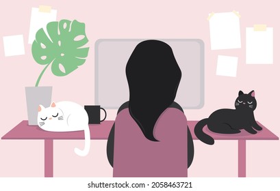 Home office. Cozy workplace. Work and study remotely. a young woman is sitting in front of a desktop computer. Cats sleep on the table and prevent their mistress from working