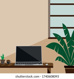 Home office desk There is a notebook computer, coffee and light passing through the window.