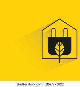 home and plug, eco home and smart home concept yellow background
