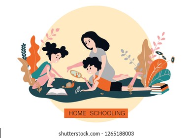 Home schooling. Education apps. A boy and a girl together with their mother study animals and plants in the garden. Training and development of children in homeschool.