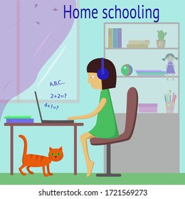 Home schooling . Learn at home. A girl studies at home online. A child with a laptop in headphones at home.