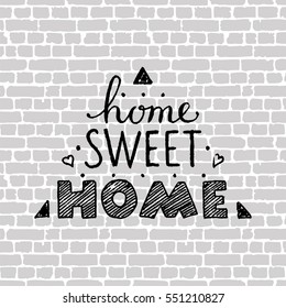 Home sweet home. Hand lettering poster. Gray brick wall background.