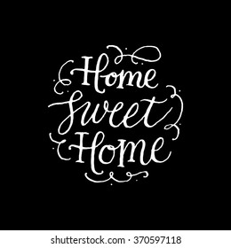 Home sweet Home.
Handwritten inscription on black background. Hand drawn calligraphy lettering for banner, calendar, planner, poster, t-shirt, postcard, save the date card. Vector illustration.