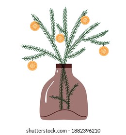 Homemade Christmas decor with twigs and orange on a branch in a glass bottle.