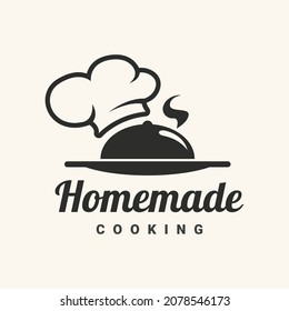 Homemade cooking logotype with food on the tray with chef hat. Vector illustration.