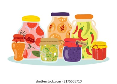 Homemade jars for preserving fruits and vegetables.A set of glass jars with canned vegetables, compotes and berry jams. Winter supplies. Autumn harvest season.
