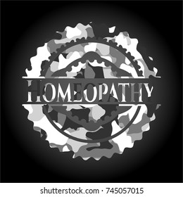 Homeopathy written on a grey camouflage texture