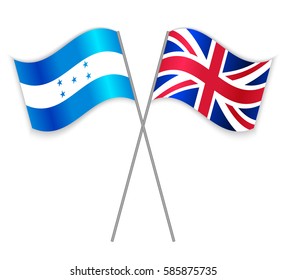 Honduran and British crossed flags. Honduras combined with United Kingdom isolated on white. Language learning, international business or travel concept.