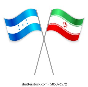 Honduran and Iranian crossed flags. Honduras combined with Iran isolated on white. Language learning, international business or travel concept.