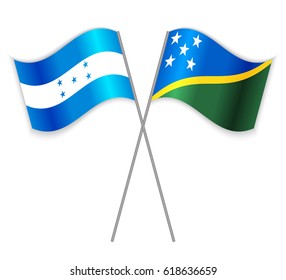 Honduran and Solomon Island crossed flags. Honduras combined with Solomon Islands isolated on white. Language learning, international business or travel concept.