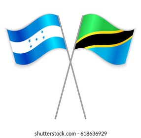 Honduran and Tanzanian crossed flags. Honduras combined with Tanzania isolated on white. Language learning, international business or travel concept.