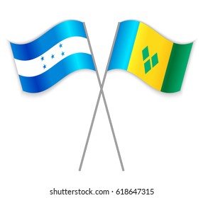 Honduran and Vincentian crossed flags. Honduras combined with Saint Vincent and the Grenadines isolated on white. Language learning, international business or travel concept.