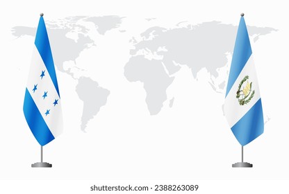 Honduras and Guatemala flags for official meeting against background of world map.