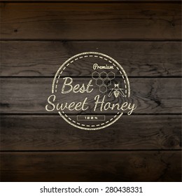 Honey badges logos and labels for any use, on wooden background texture