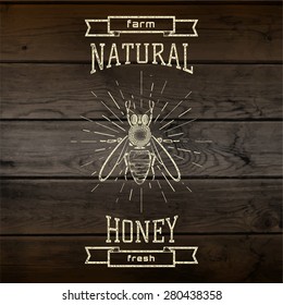 Honey badges logos and labels for any use, on wooden background texture