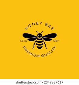 A honey bee logo on a yellow background. The bee is black and yellow, and it is facing the viewer.