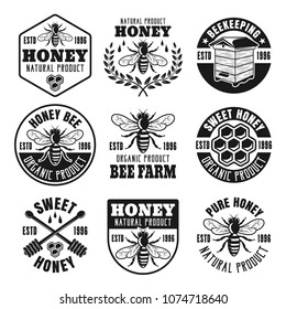 Honey and beekeeping set of vector emblems, badges, labels or logos in monochrome style isolated on white background