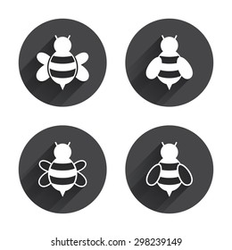 Honey bees icons. Bumblebees symbols. Flying insects with sting signs. Circles buttons with long flat shadow. Vector