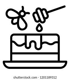 Honey dripping over dessert cake with honey wand 