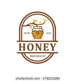 Honey logo design, with honeycomb hangs on a tree.