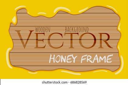 Honey syrup flowing drops frame on wooden background