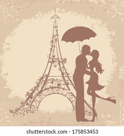 Honeymoon and Romantic Travel. Happy young lovers couple kissing in front of Eiffel Tower, Paris, France. 