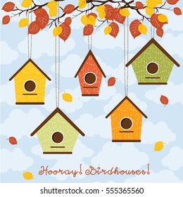Hooray, birdhouses! Five cute birdhouses hanging from the branches.