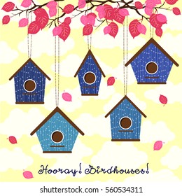 Hooray, birdhouses! Five cute birdhouses hanging from the branches.