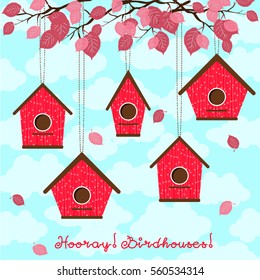 Hooray, birdhouses! Five cute birdhouses hanging from the branches.