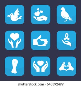 Hope icon. set of 9 filled hope icons such as dove, ribbon, heart on hand, hands holding heart
