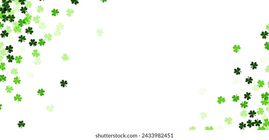 A horizontal band of clover leaves in various shades of green creates a natural border against a white background, perfect for St. Patrick's Day headers or banners.