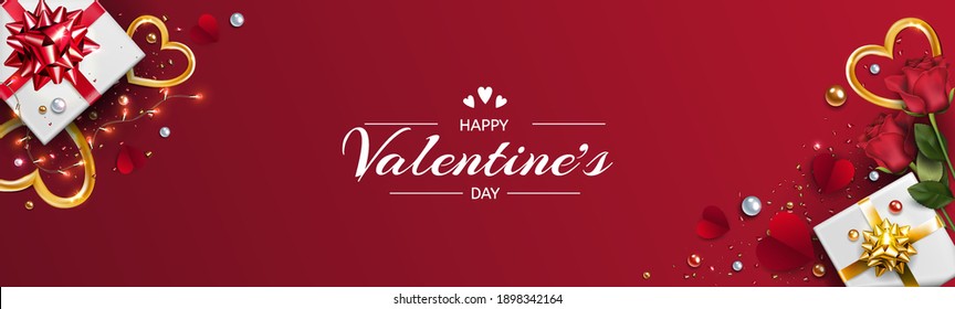 horizontal banner for valentine's day. Red background, valentine card with gift, gold and red hearts, top view. Template for party invitation card, banner, coupon, wedding card or advertising banner. 