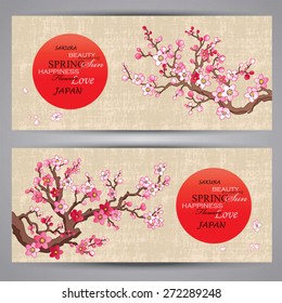 Horizontal banners with branches of the blossoming cherry-tree and the sun on textural paper 