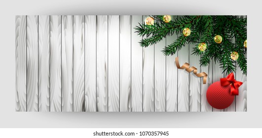 Horizontal card with wooden background. Green branches, a gold ribbon, a knitted ball with a red bow. Happy New Year and Merry Christmas. Vector.