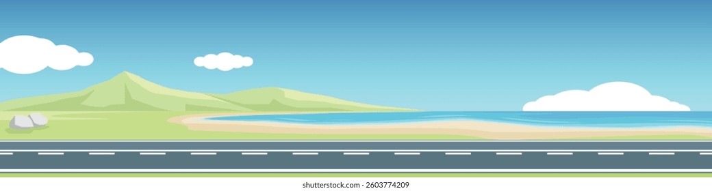 Horizontal or Lanscape view of asphalt road. A long road cuts through the beach. Open grasslands reveal the distant mountains clearly. Under clear sky and white clouds.