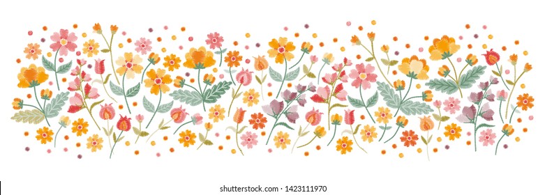 Horizontal pattern with embroidered wild flowers on white background. Panoramic view of floral meadow.
