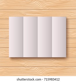 Horizontal rectangle folded grey sheet of paper with shadow on wood background, four tiles, vector mock-up