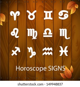 Horoscope signs - symbols. white signs on the background of wooden boards