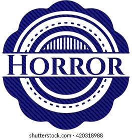 Horror badge with denim background