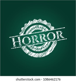 Horror chalk emblem written on a blackboard