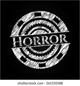 Horror chalk emblem written on a blackboard