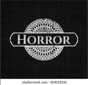 Horror chalkboard emblem written on a blackboard