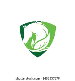 horse logo with green leaves shield security vector icon design